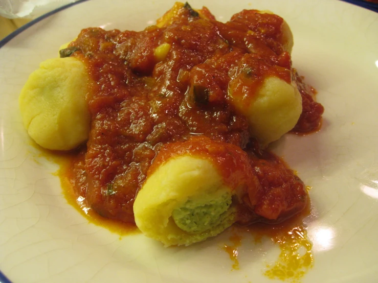 closeup of a meal on a plate consisting of food including broccoli and potatoes