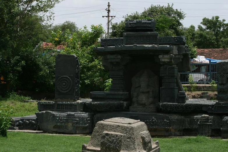 a couple of stone structures in a field