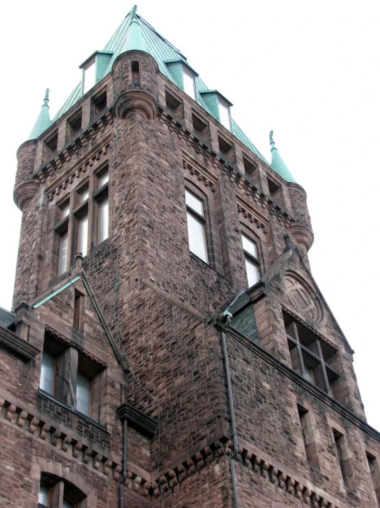 a large brick building with some blue windows