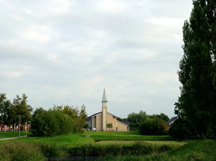 view of small church from across a creek