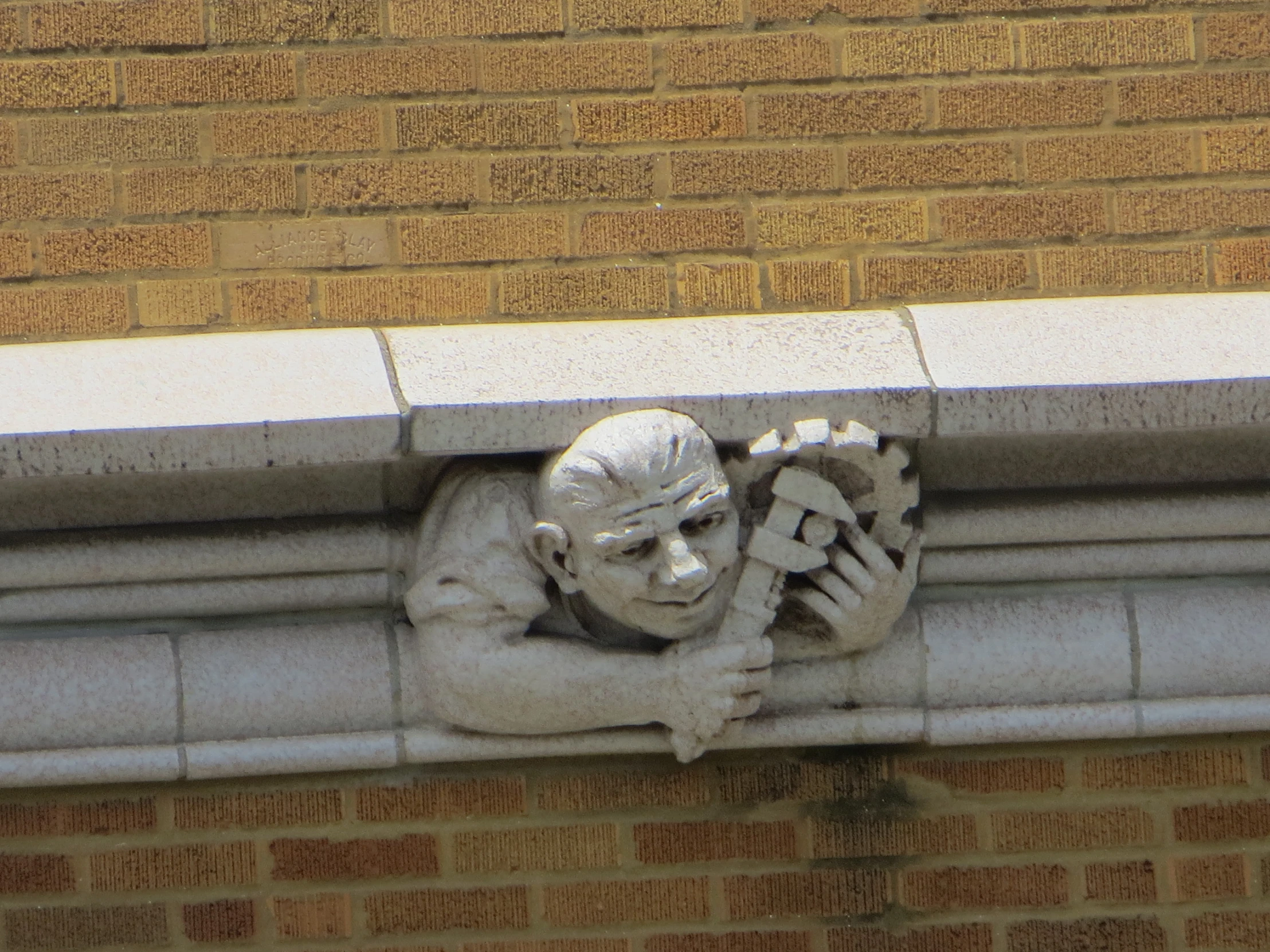 a face of an old man on a wall