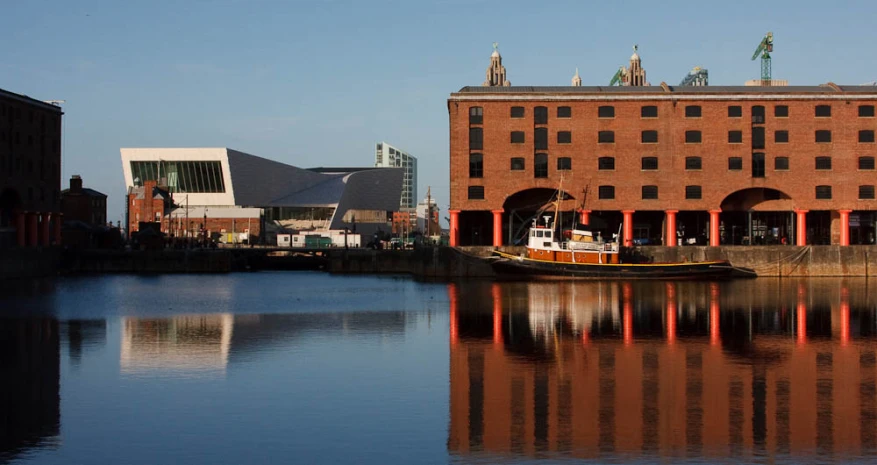 there is a barge that is parked on the water