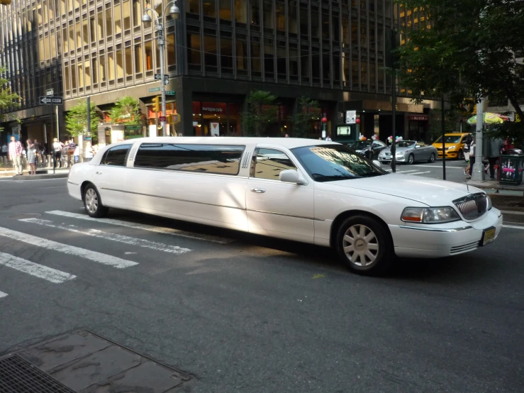 the limo is parked on the side of the road