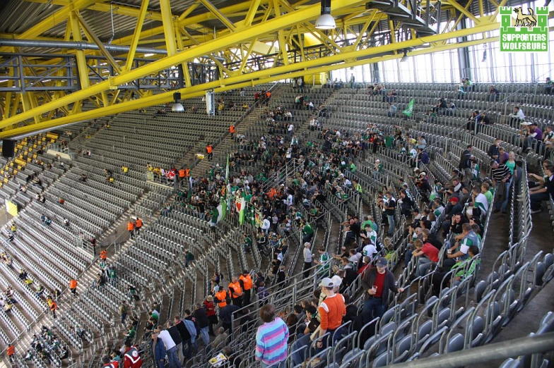 the stadium is filled with spectators on a sunny day