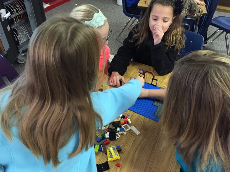 a group of s playing with legos