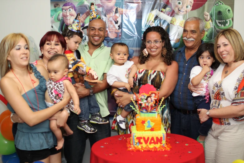 a group of people posing for a po at a birthday party