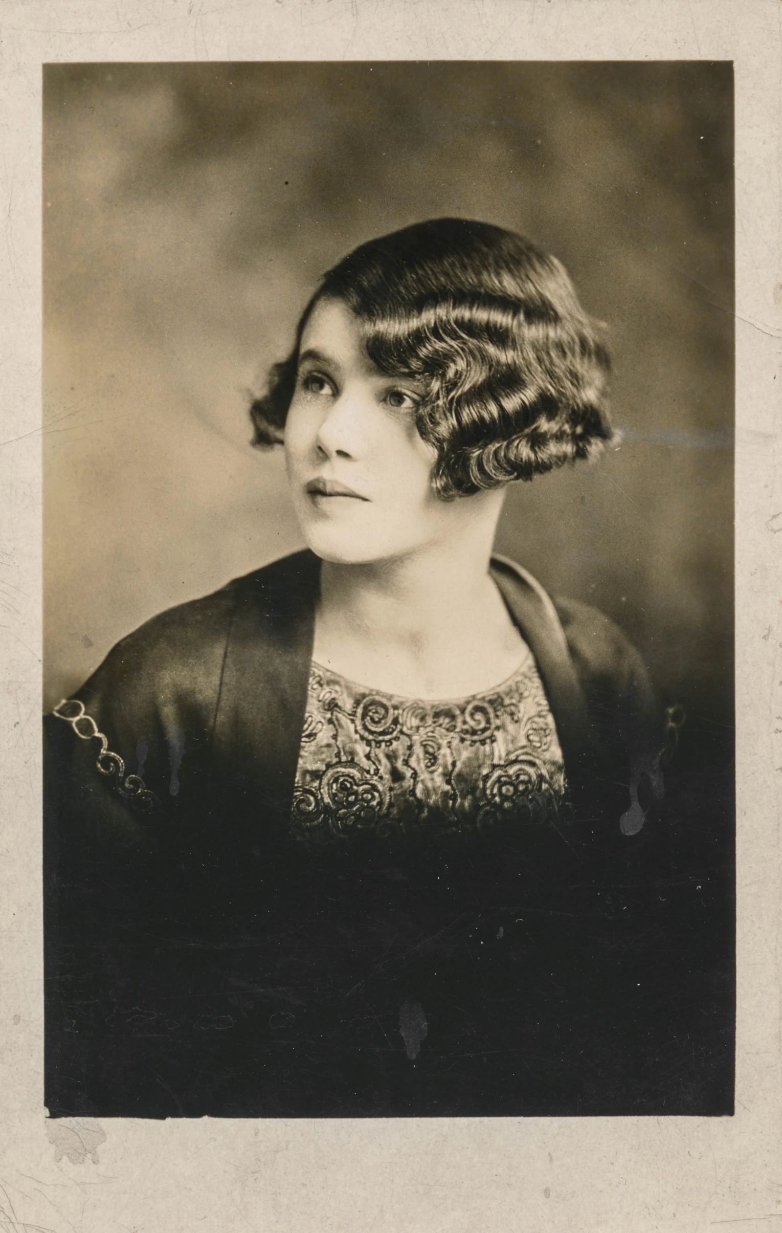 old fashion picture of a woman with curly hair