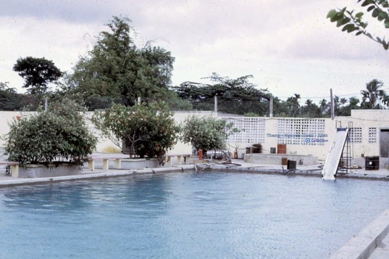 a swimming pool with a slide in it