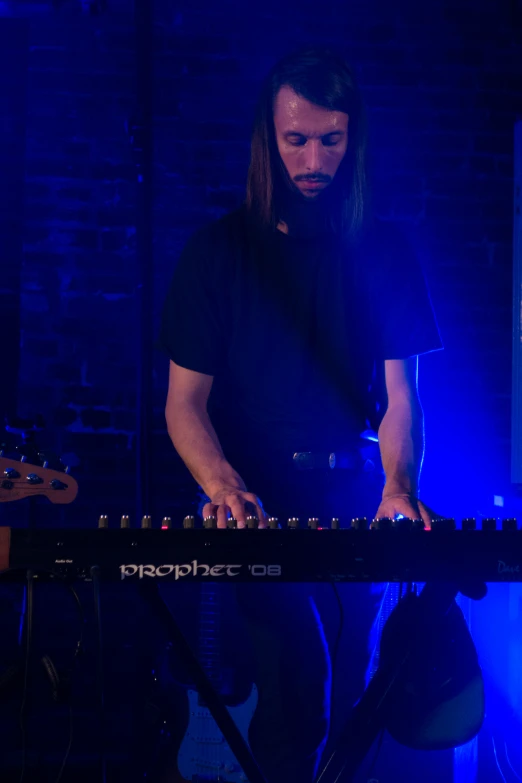 a man standing in front of a keyboard