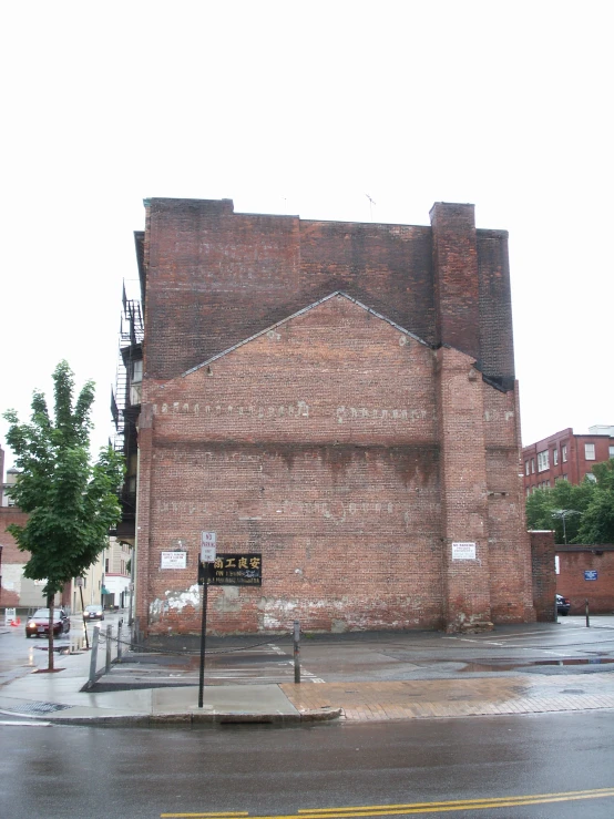 a large brick building that has graffiti on the side of it