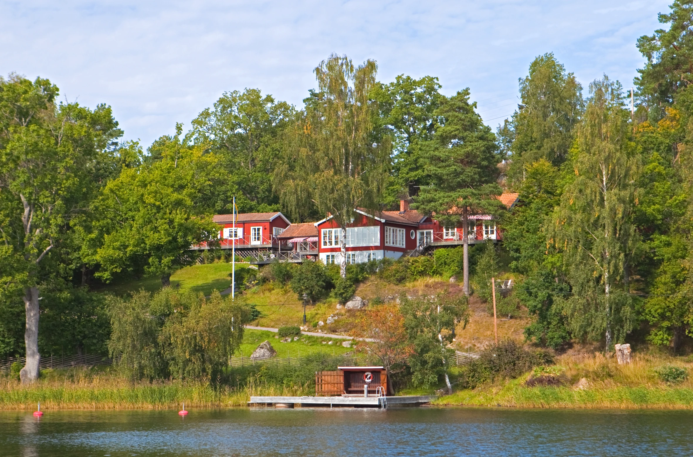 the house on the hill near the water