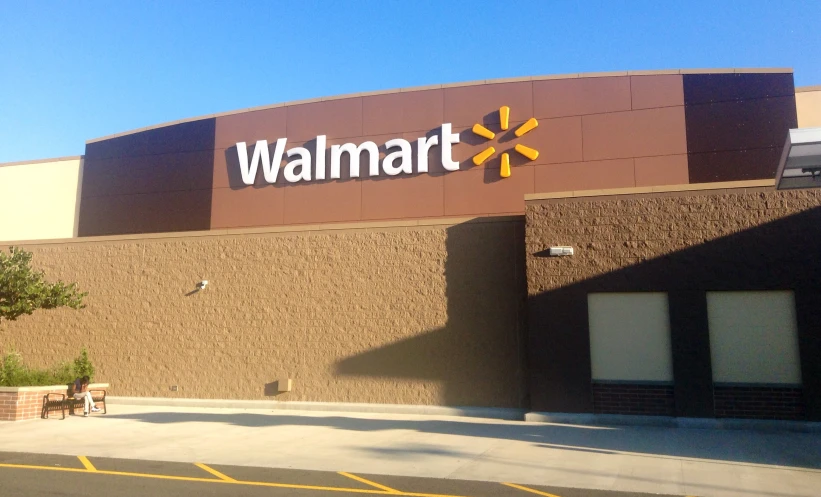 a walmart store front, with a yellow flower