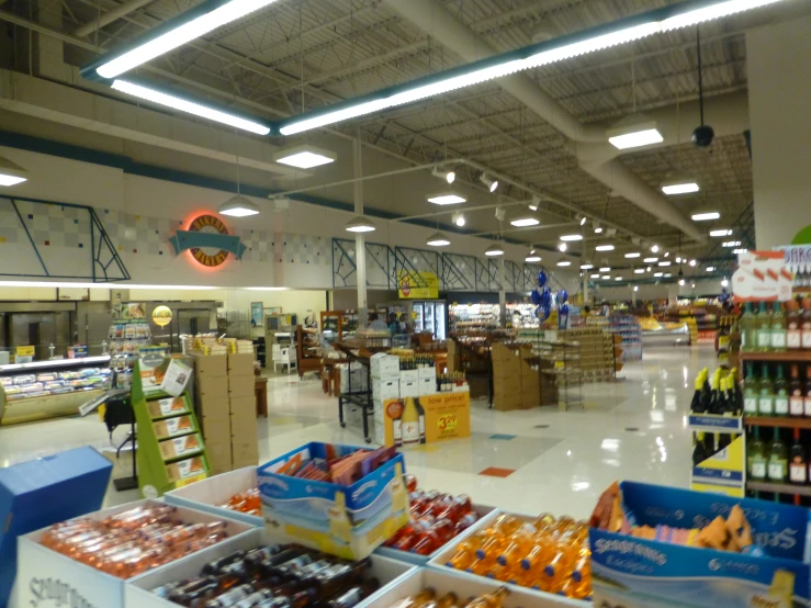 an open space in a store filled with fruits and condiments