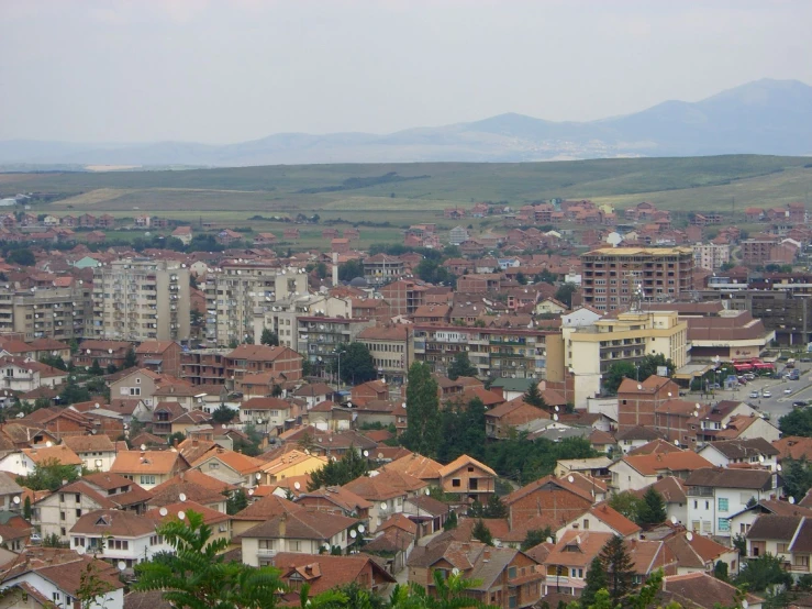 the view of a town near a mountainous area
