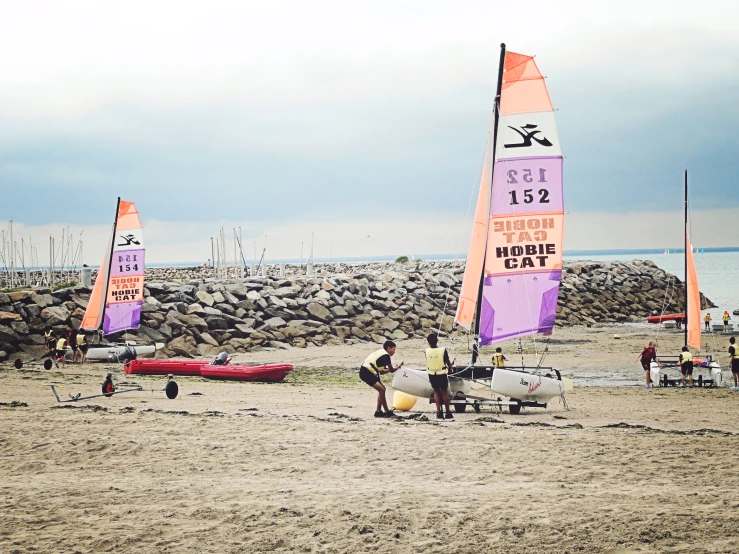 sailboats on the shore of a sandy beach