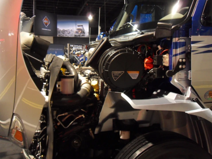 the front of a large, articulated vehicle at an exhibition