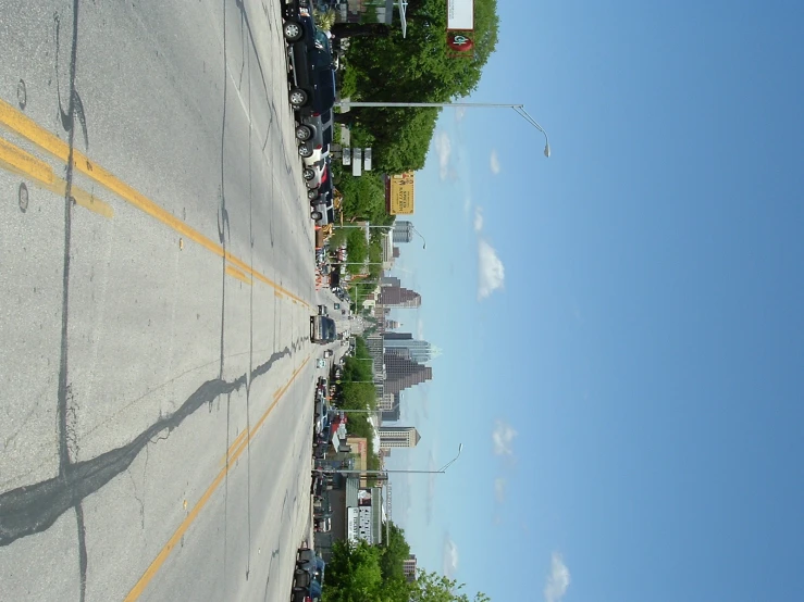 cars parked on the side of the road, and traffic signs