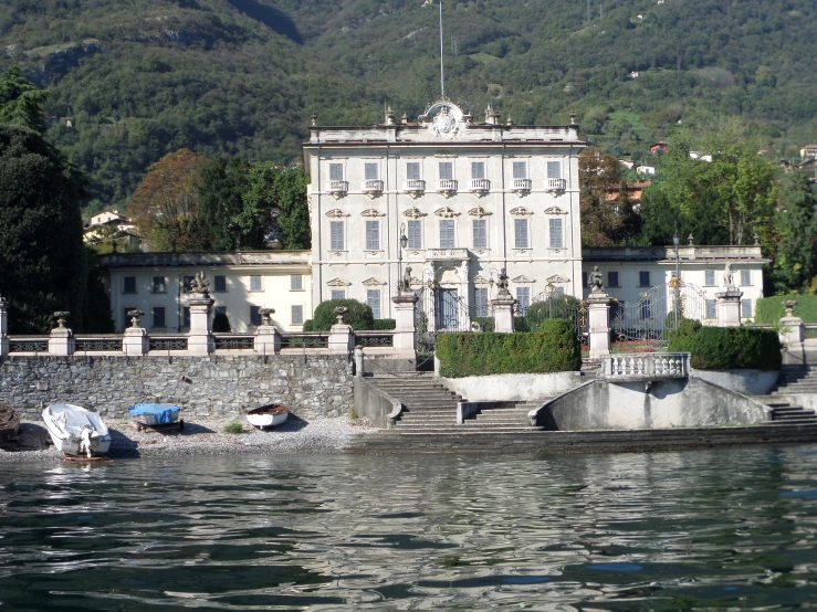 a large palace sitting next to a body of water