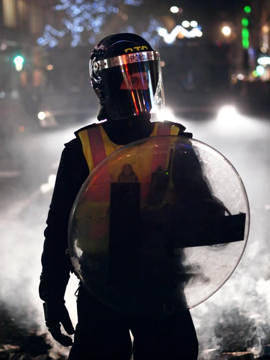 a person in a helmet holding a large object