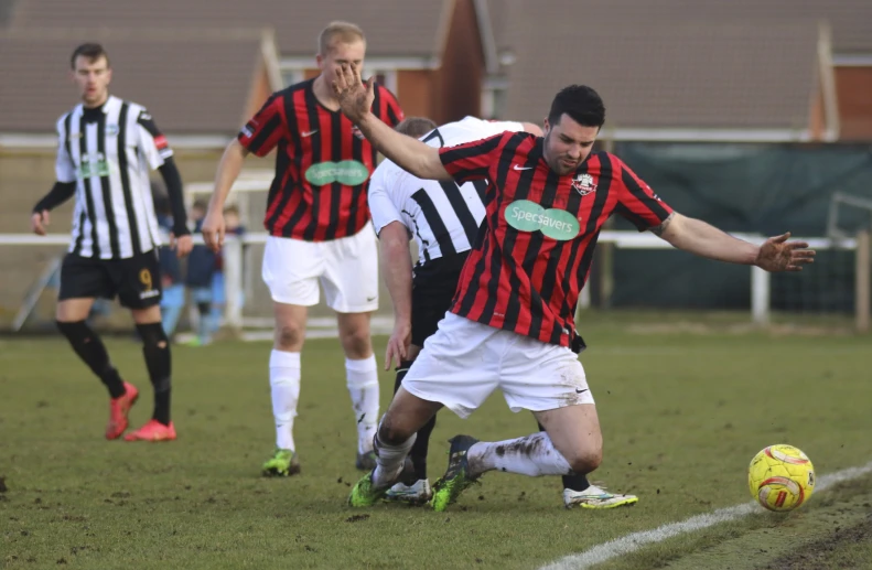 a couple of young men playing a game of soccer