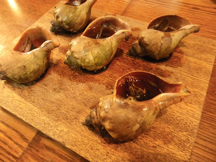 different types of items in wooden bowls placed on table