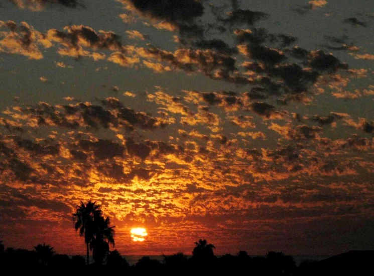 there is a very colorful sky as the sun sets