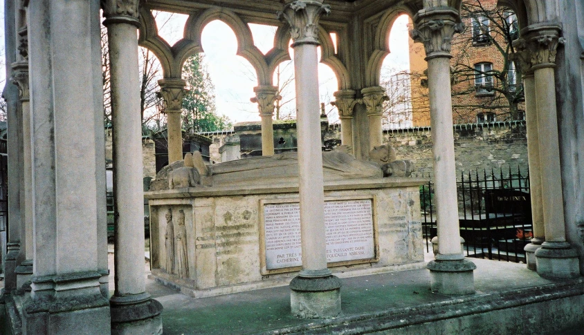 an old cemetery with several columns and arches