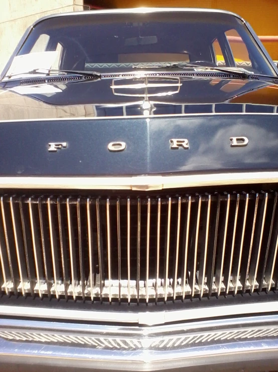 a ford grill is shown parked in the sun