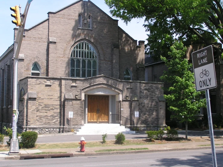 a church that has a fire hydrant in front