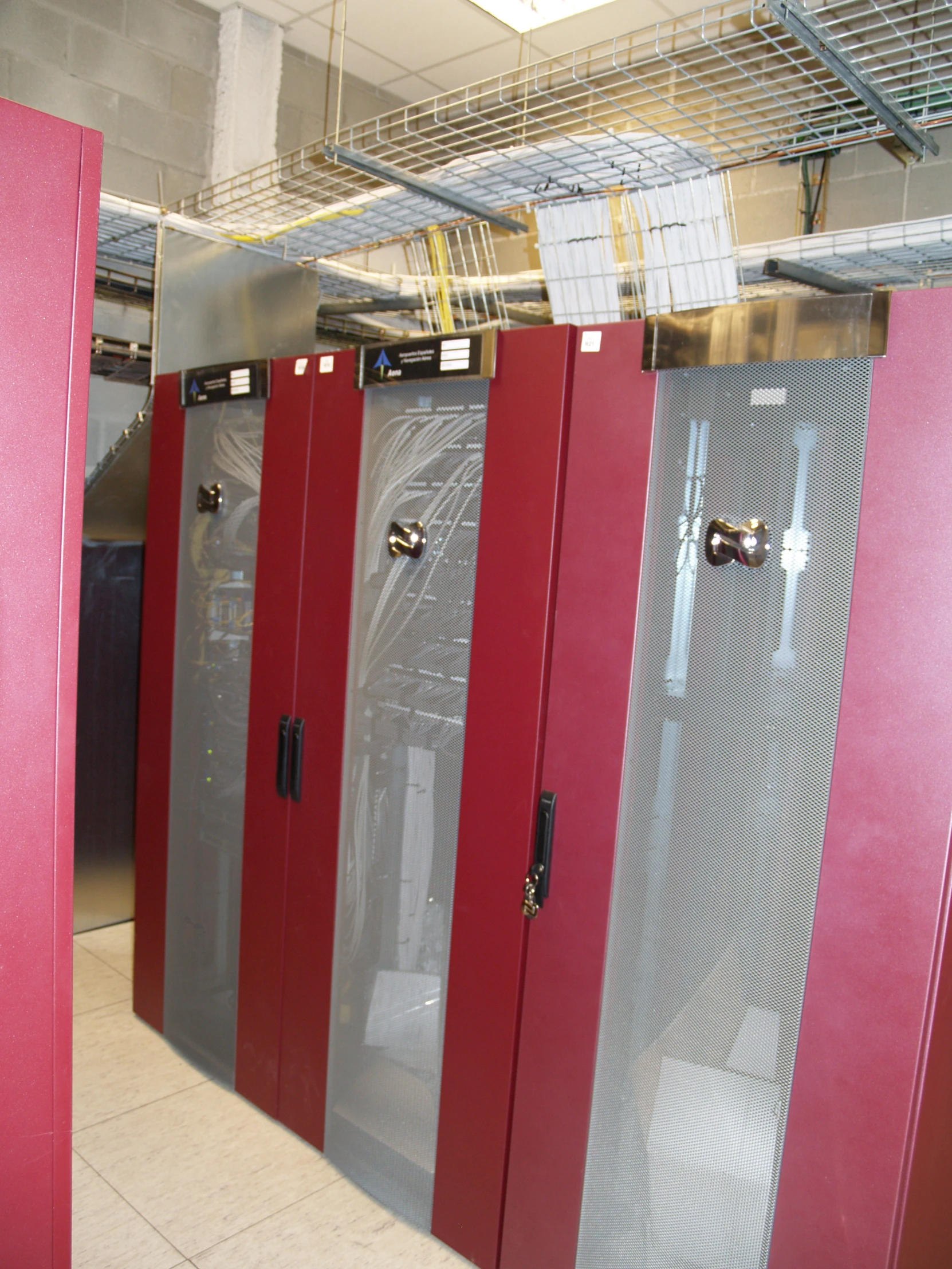 several red and gray storage cabinets in a room