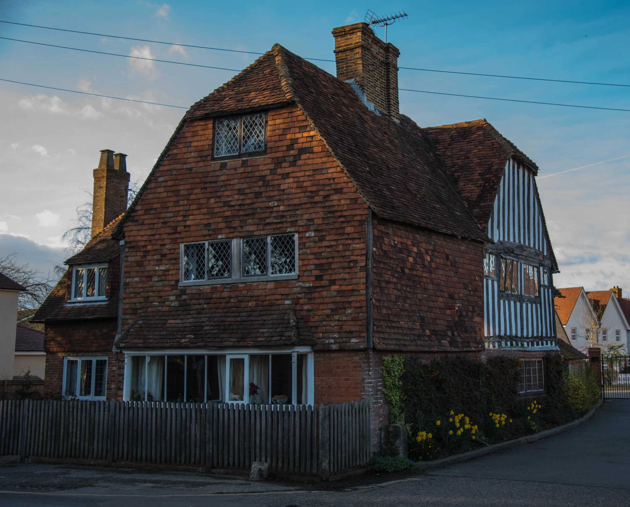 an old house has a tower with a window on it