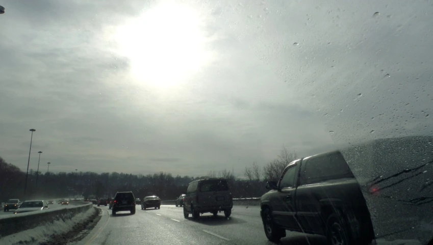 cars traveling on a highway with snow