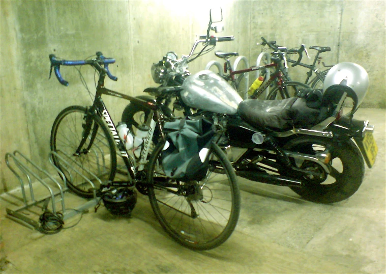 some bikes are sitting up against a wall