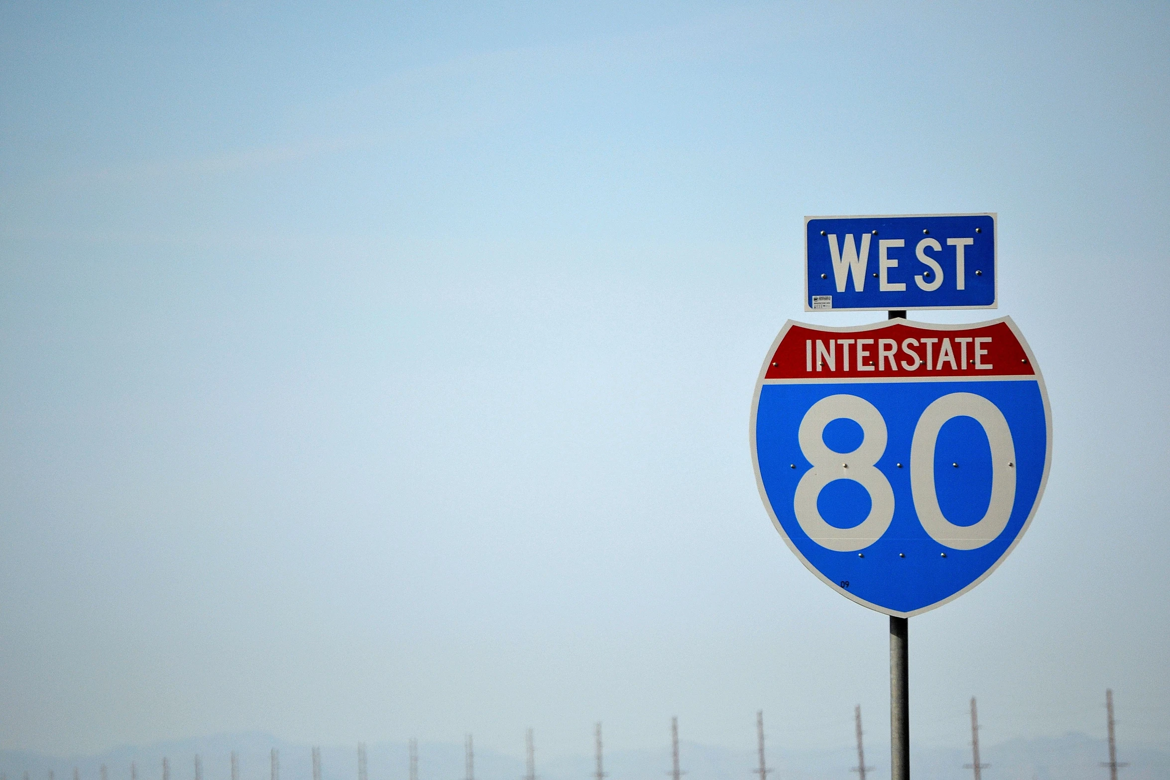 a sign for the west interstate at an intersection