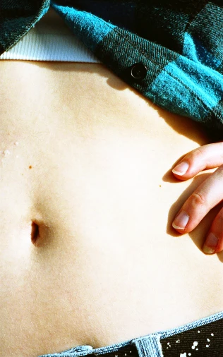 a woman's abdomen showing a bump in her stomach