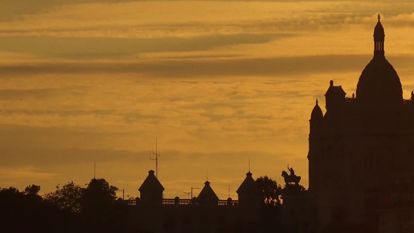 a very tall tower with a spire and a bell