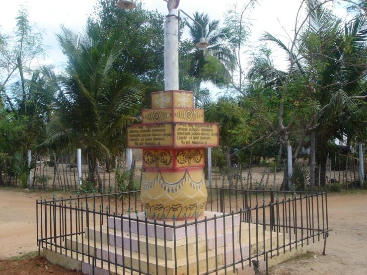 a large metal monument with many signs on it