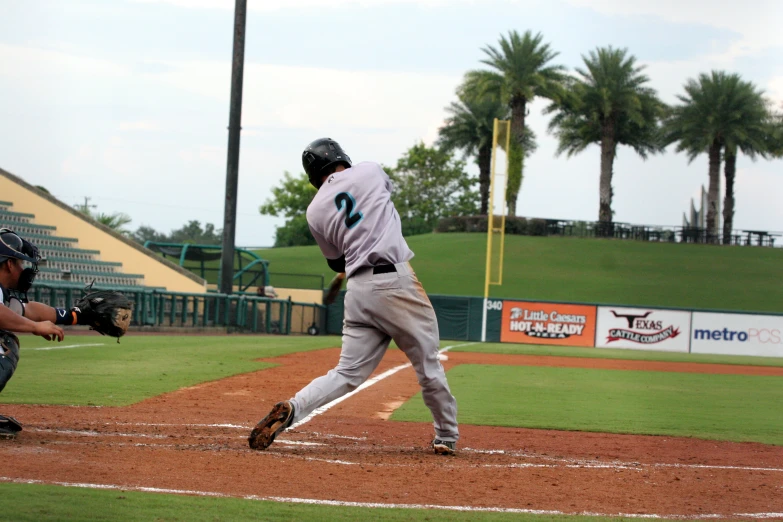 a batter swinging his bat at the ball during a game