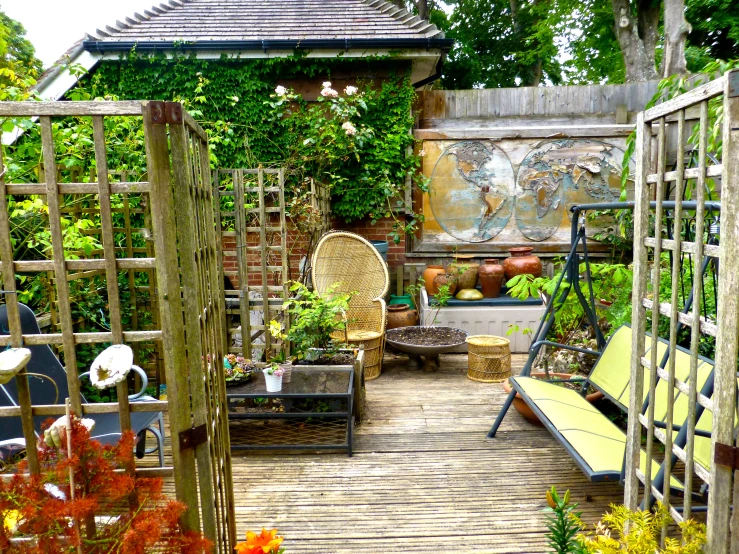 small back yard patio with an abundance of plants and hanging potted plants