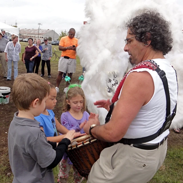 people with fire sticks in their hands standing around