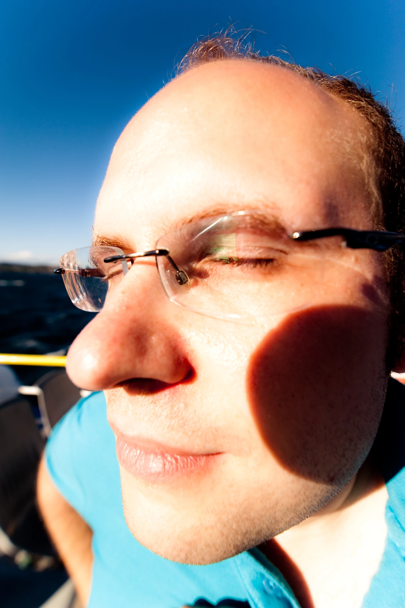 a close up of a person wearing glasses