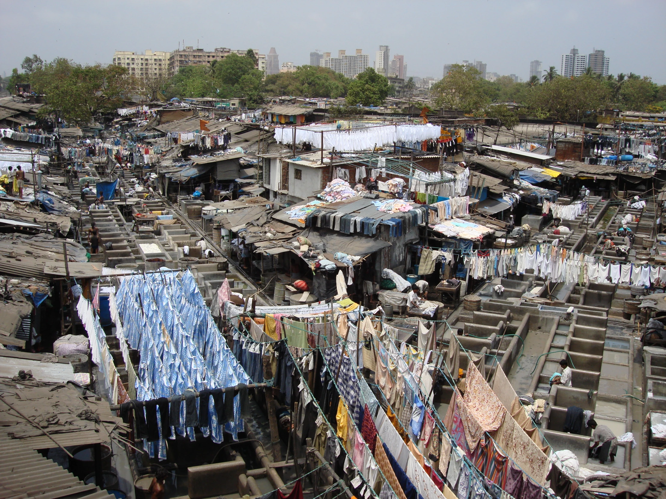 this po depicts an outdoor area of clothes and shacks