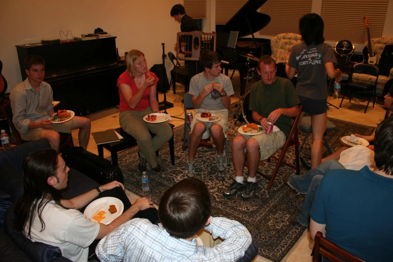 people eating and watching soing from behind