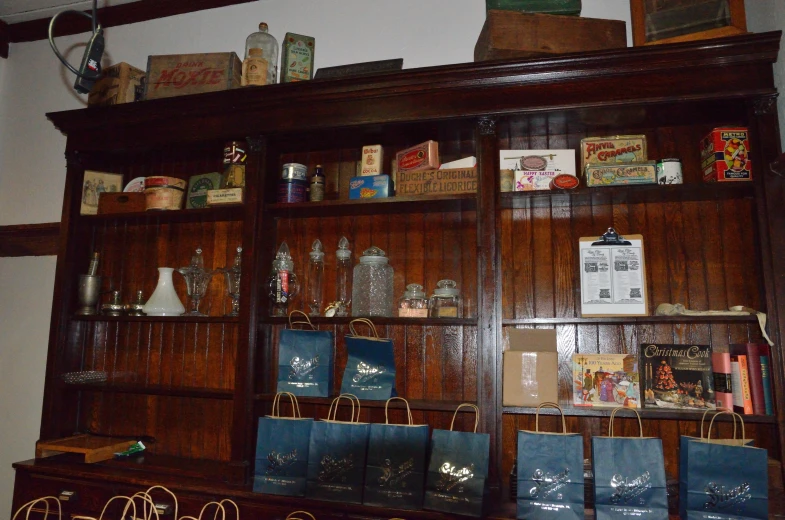 the room is furnished with large wooden shelves