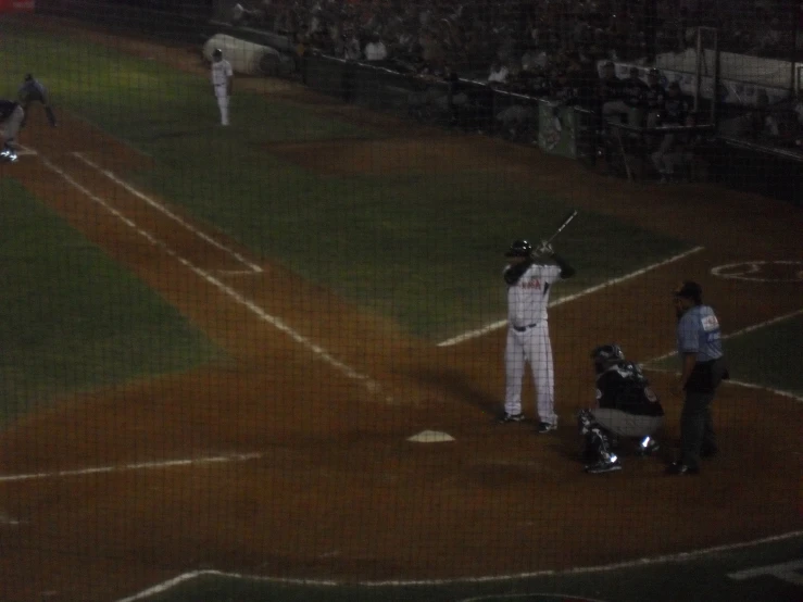 a batter, catcher and umpire during a baseball game