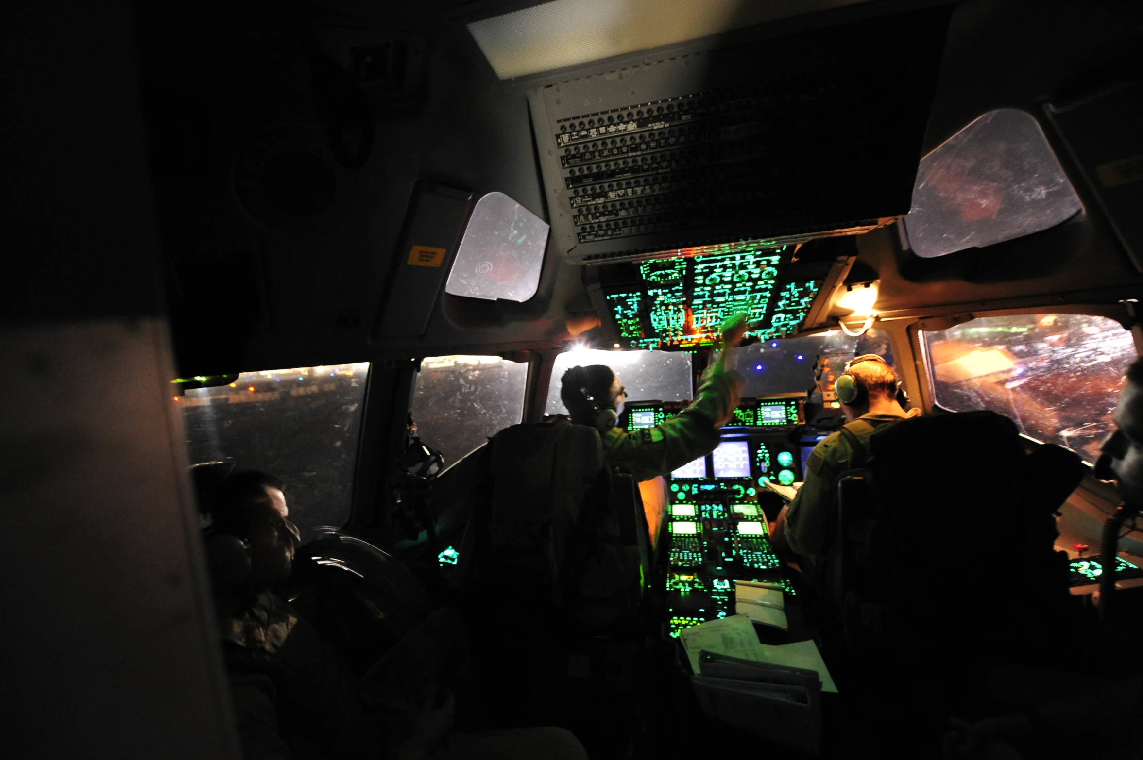 two pilots in the cockpit of a plane