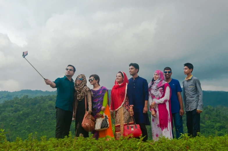 a group of people standing in a field