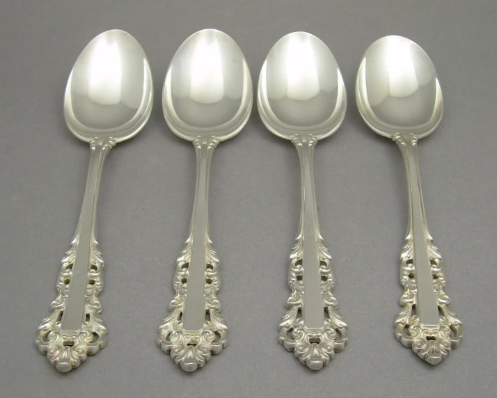 five different types of antique silver spoons