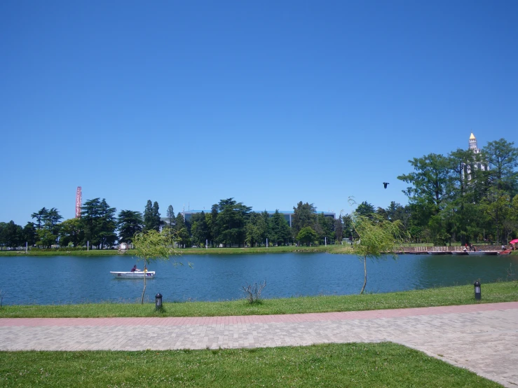 view of a large lake with small boats in it