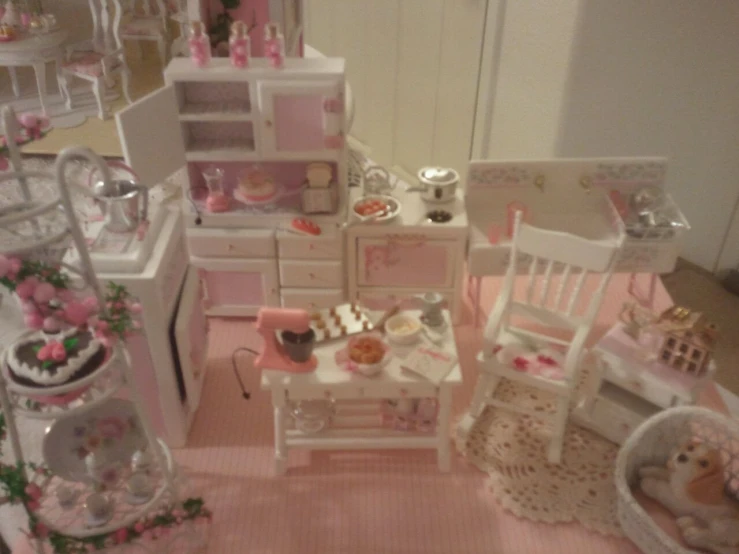 a dollhouse filled with furniture and lots of accessories